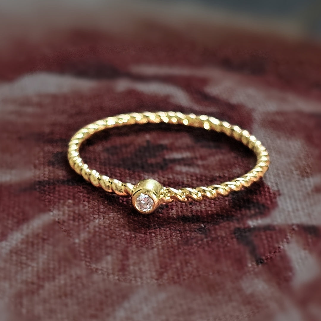 Minimal Twisted Gold-Plated Silver Ring with Diamond