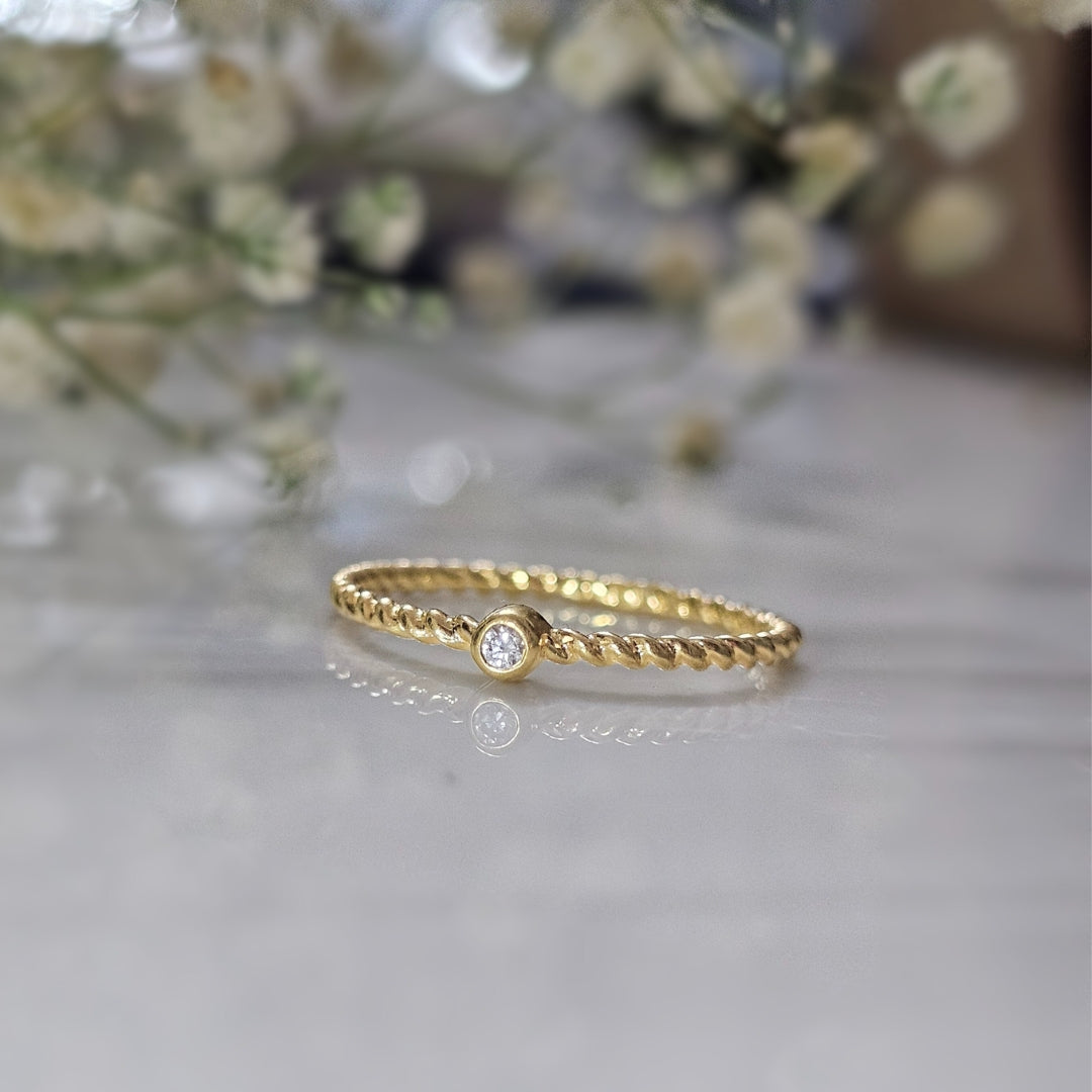 Minimal Twisted Gold-Plated Silver Ring with Diamond